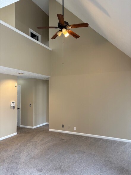 Downstairs looking to MBR Hallway, Half Bath, Laundry Room and Door to Garage - 2316 Peak Hill Cv