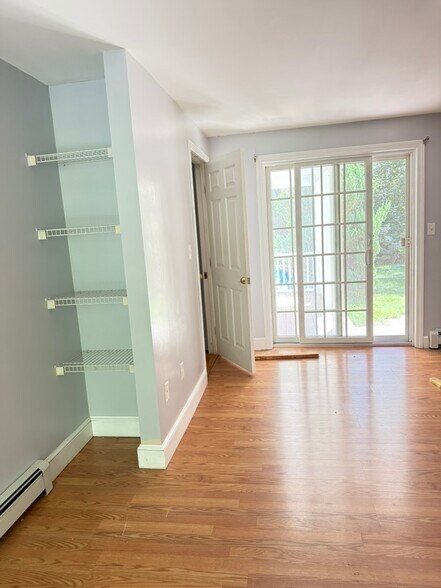 Bedroom facing sliders out to front farmer's porch - 20 Partridge Ln