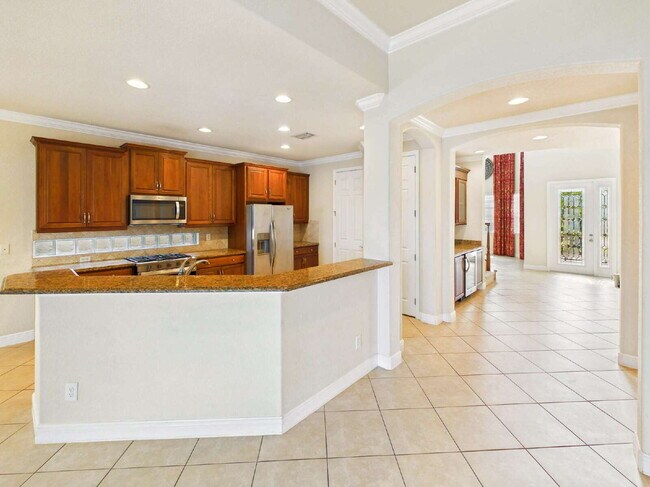 Building Photo - Luxury Lakefront Pool Home in Tesoro - Move-in Ready with Premium Inlcusions