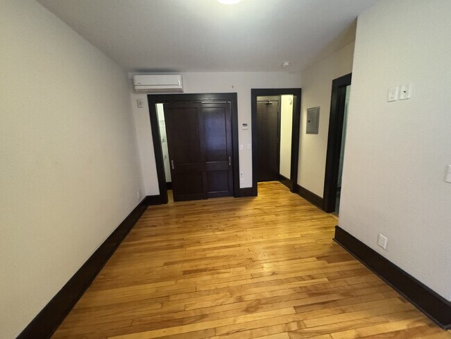 Building Photo - "Charming Studio Retreat with Hardwood Elegance in Downtown Minneapolis!"