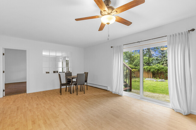 Another view of the recreational room featuring access to a bedroom and backyard. - 45 High St