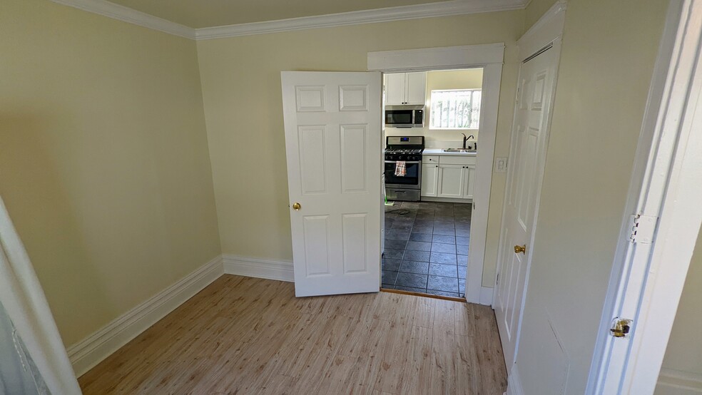 Bedroom 2 looking out into kitchen - 2852 S Palm Grove Ave