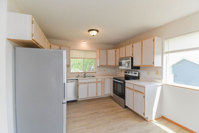 Building Photo - Updated 3BR Split-Level Home with Huge Deck, Fenced Yard & 2-Car Garage Near I-29!