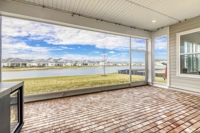 Building Photo - Resort-Style Furnished Lakefront Living in SilverLeaf | 100” Theater & Golf Cart Included