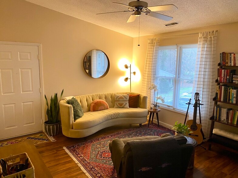Living with door to stairs - 121 Westview Dr