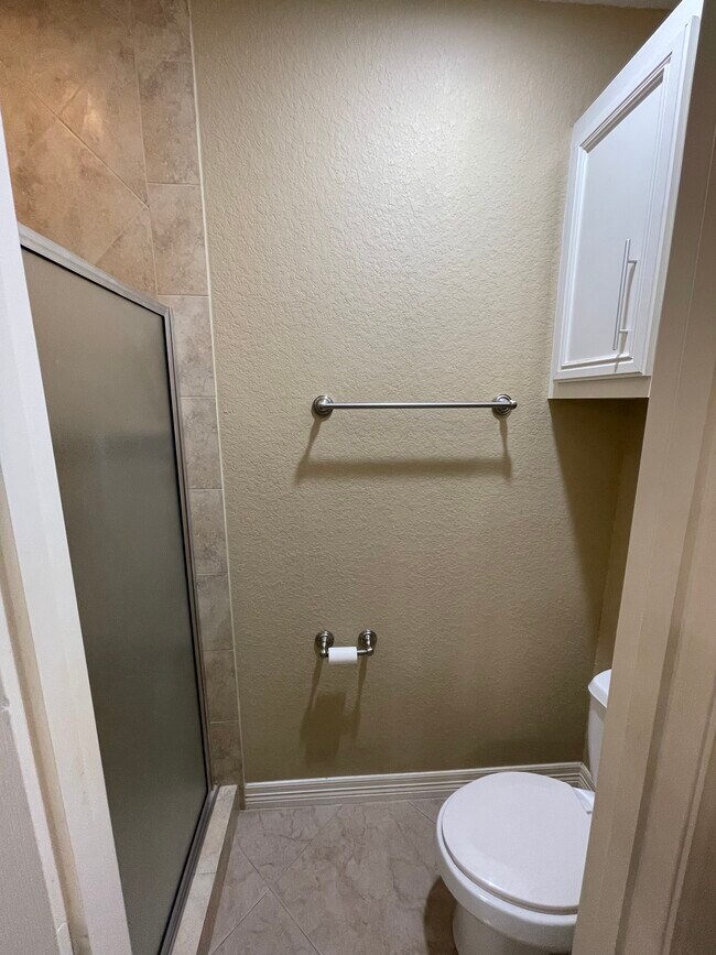 Master bathroom shower and toilet - 600 River Bend Dr