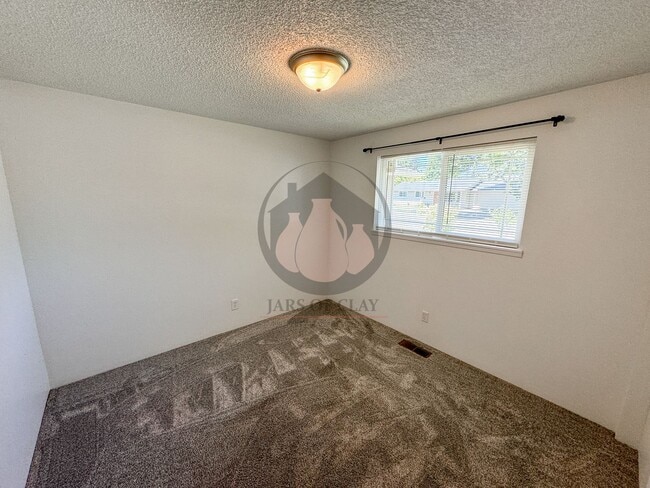 Building Photo - READY NOW! Charming Single-Level 3BD/2BA with Central AC, Wood Fireplace, and Landscaping Included!