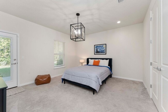 Building Photo - Introducing a captivating 3-story townhome...