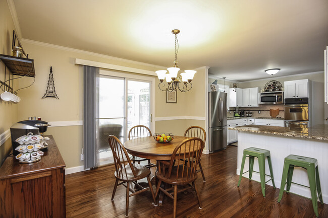 Photo 13. Open plan Kitchen and Dining Room with sliding door to Sun Room - 1623 Lethia Dr