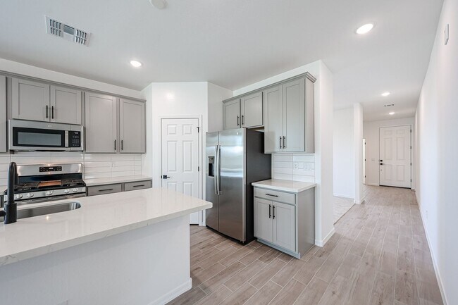 Building Photo - Modern Mountainside Living: Stunning New 4-Bedroom Home in Estrella Crossing! 3 CAR GARAGE!