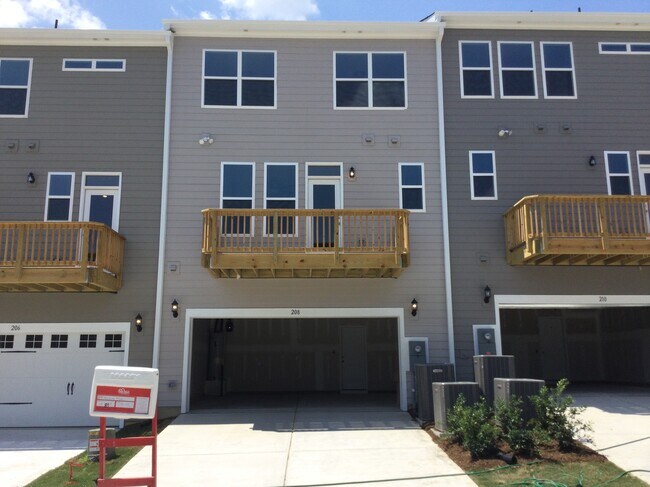 View from the back with entry to garage - 208 Hickory Plains Rd