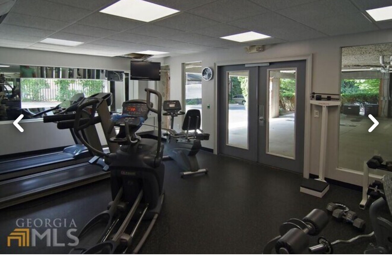 Modern gym, with security entrance. - 5559 glenridge dr,