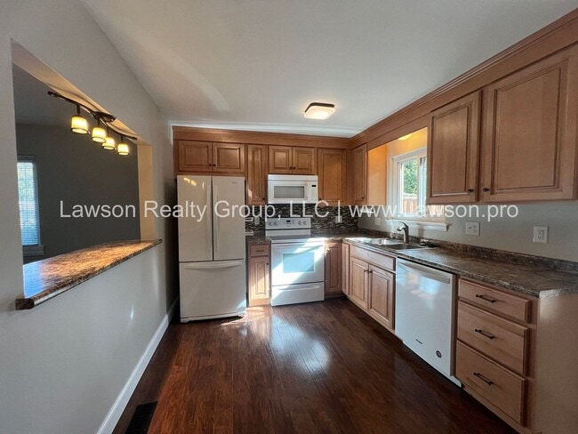 Building Photo - Charming Brick Ranch with Beautifully Landscaped Yard and Attached Carport