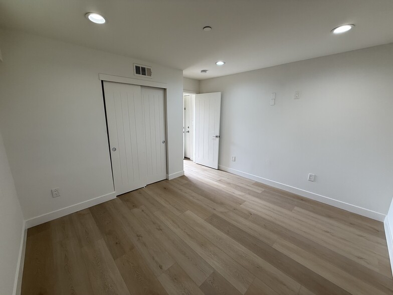 1ST BEDROOM NEW FLOORING - 646 N Serrano Ave