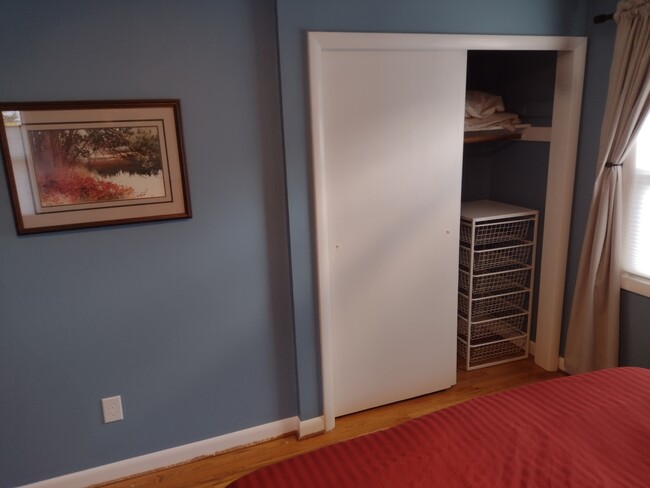 Primary Bedroom Closet with wonderful Jonaxle 6-drawer shelving. - 4157 SE Brooklyn St