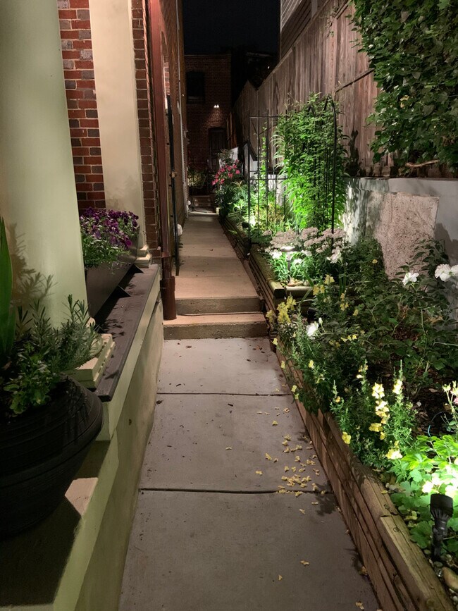garden walkway from front of home to back deck/apt entrance - 1869 Park Rd NW