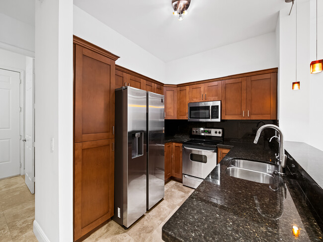 kitchen with stainless steel appliances - 1226 NE 14th Ave