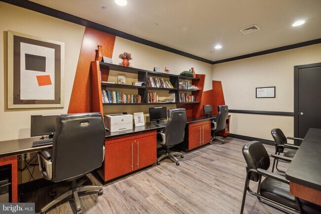 Building Photo - This townhouse style condo is located across the street from the Vienna Metro Station (Orange Line).