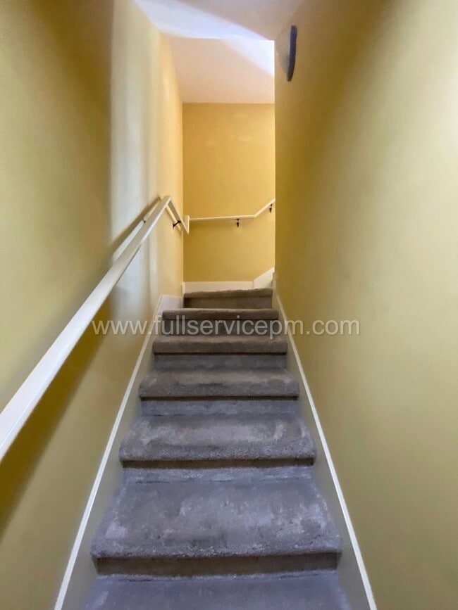 Building Photo - Spacious townhome with private backyard, garage parking, multiple decks, and a dedicated home off...