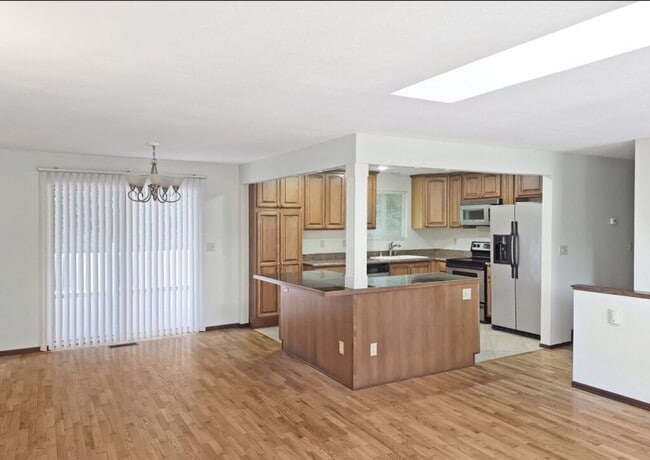 Building Photo - Split-Level Stunner with Skylight, Hardwoods & Room to Grow