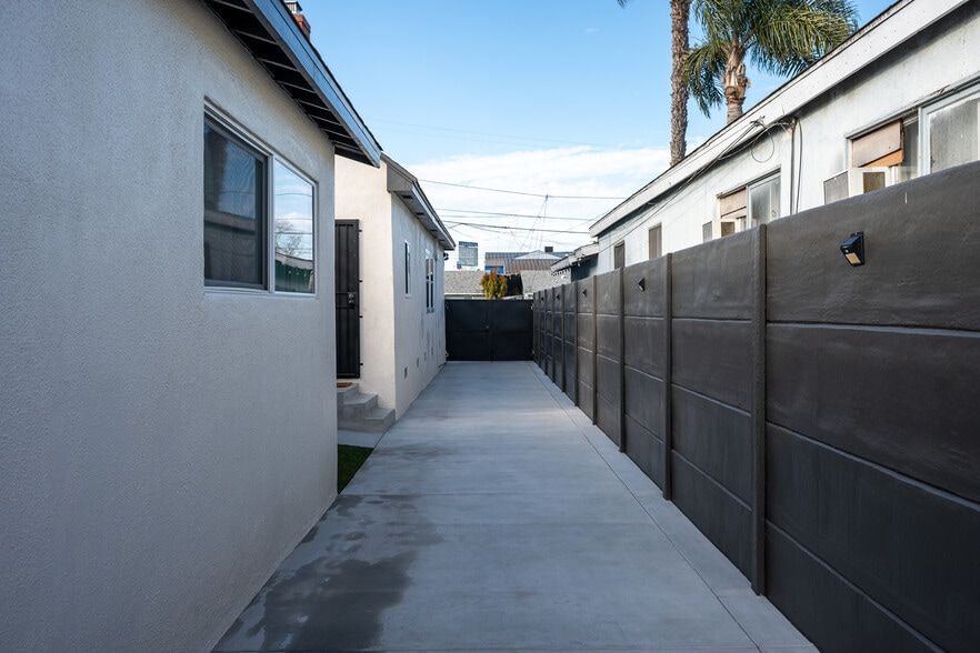 Driveway view toward double gate vehicle entry. The driveway double gate is manually operated. - 4746 W 159th St