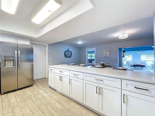 Building Photo - Modern luxury meets Florida charm in this ...