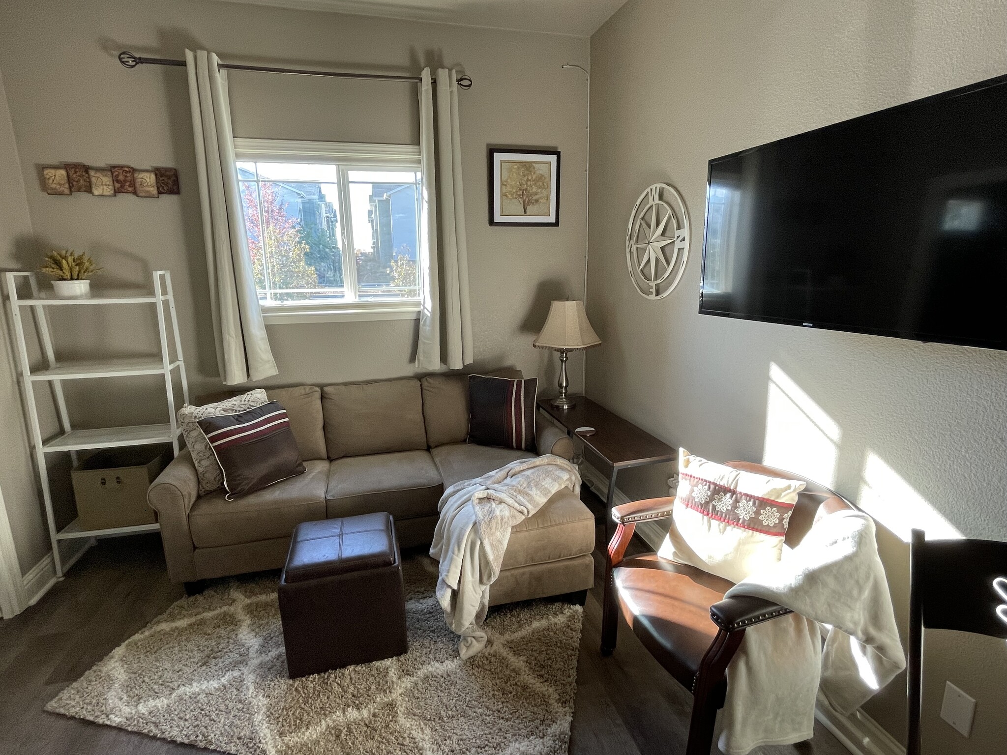 Living area w window shade * blackout curtains - 2986 E Eaton Rd