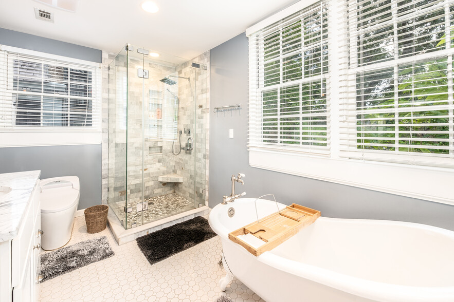 Second floor bathroom with glass enclosed shower, claw-foot tub, and heated bidet - 15 West St