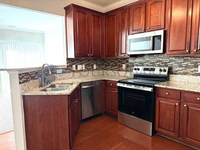 Building Photo - Lovely 3-Bedroom Townhome with Fireplace, Back Patio  & Community Amenities Included! Convenient ...