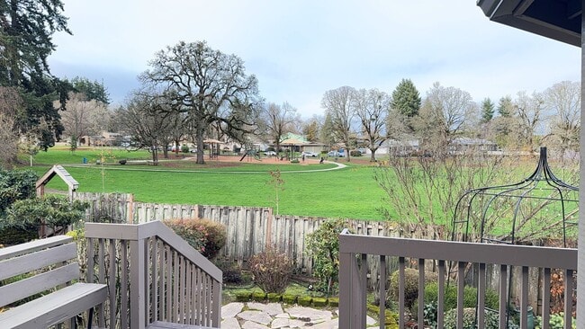 Building Photo - 4bd/3ba HUGE Home w/Hardwood Floors, Russian Fireplace, 2-Car Garage & Fenced Back Yard!