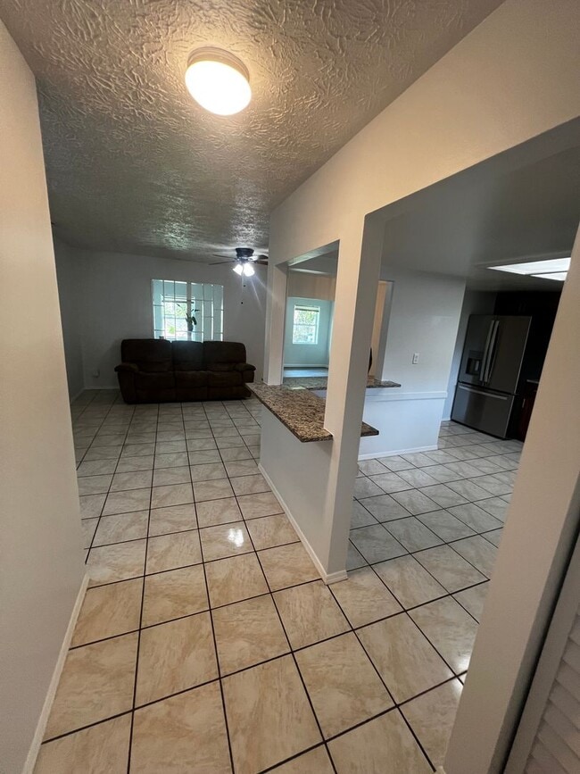 Building Photo - 3 BEDROOM 2 BATH CONVENIENTLY LOCATED WITH A TROPICAL OASIS IN THE BACK YARD!