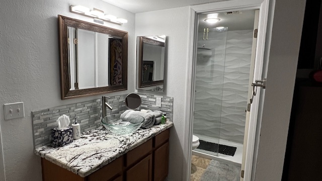 Completely new bathroom with marble and glass fixtures on-suite - 7777 E Main St