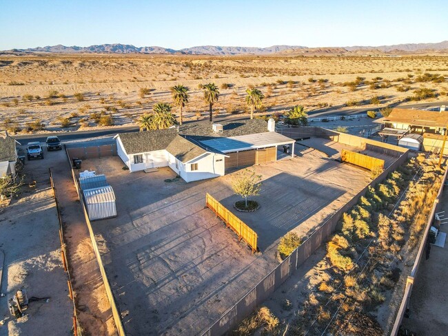 Building Photo - A Fully Furnished 3 Bedroom With Desert Mo...