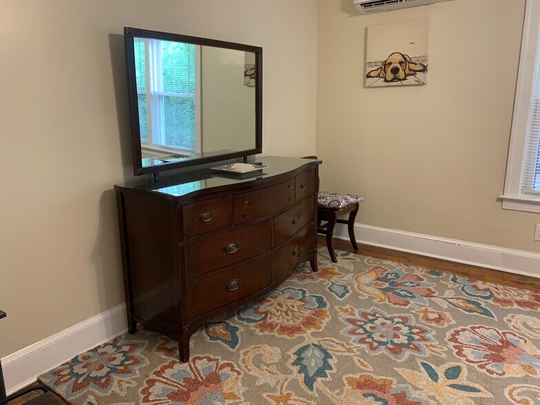 2 dressers & closet in large bedroom w/ black-out curtains - 1409 Winburn Dr