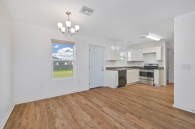 Building Photo - 3BR/2.5BA Cape Coral Home w/ 2-Car Garage & Spacious Yard – Available Now!