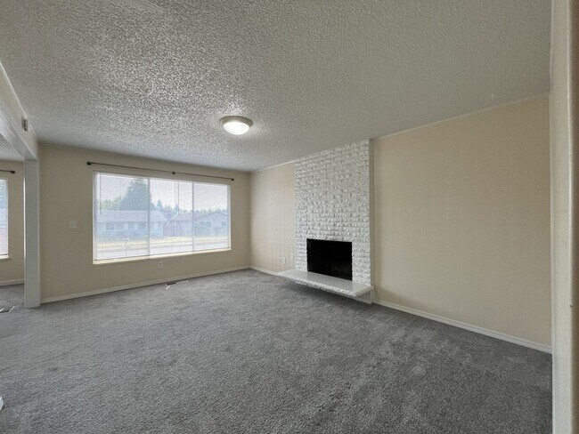 Building Photo - Charming Ranch Home with Sunroom or 4th Bedroom, Two-Car Garage and Fenced Backyard