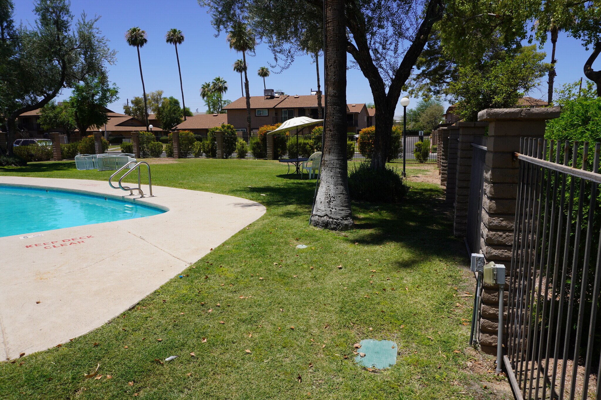 grassy area around pool - 8558 E Portland St