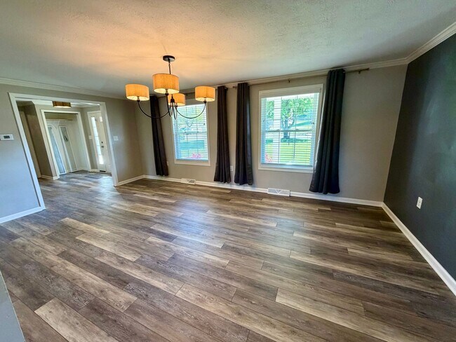 Building Photo - Modern Comforts Await: Spacious Rental with 2-Car Garage, Private Office, and Finished Basement w...