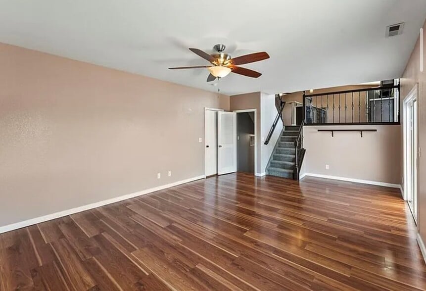 Living room facing garage and down stairs - 7390 Sue Ln