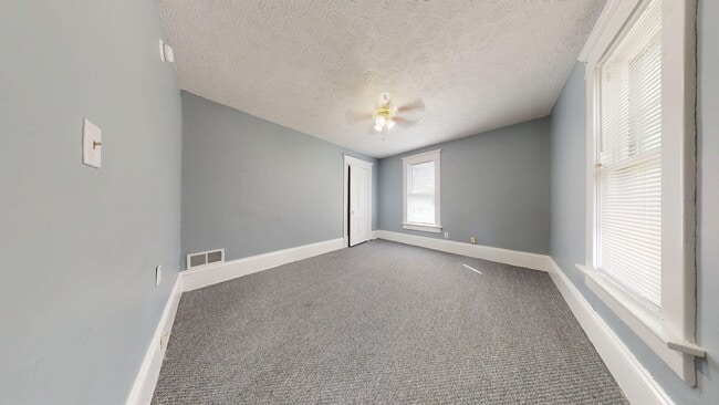 Building Photo - Freshly updated, large garage/small yard