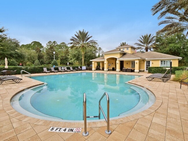Building Photo - Introducing a captivating 3-story townhome...