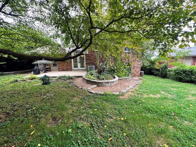 Building Photo - AVAILABLE NOW! Spacious 4 BR, 2 Bath House! Wood Floors, Attached Garage, W/D Included