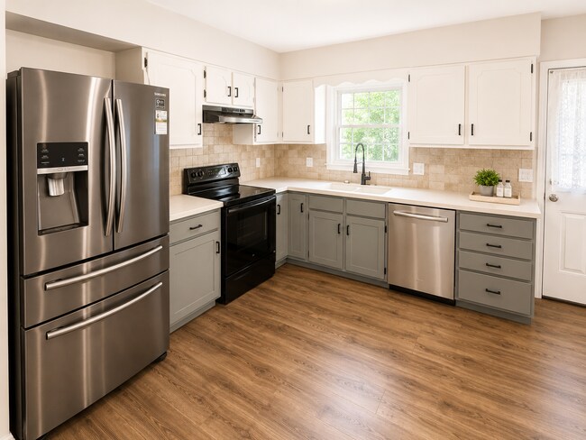 Building Photo - Spacious West Manhattan Home with Modern Updates, Oversized Garage & Prime Location
