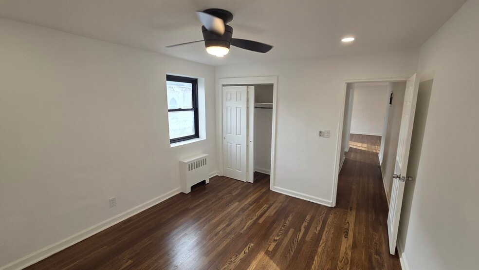 Bedroom, large closet and hardwood floors - 165 Vroom St