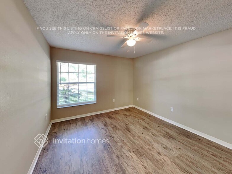 Building Photo - 1402 Whispering Woods Way
