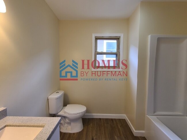 Building Photo - Downstairs | Three Bedroom Duplex