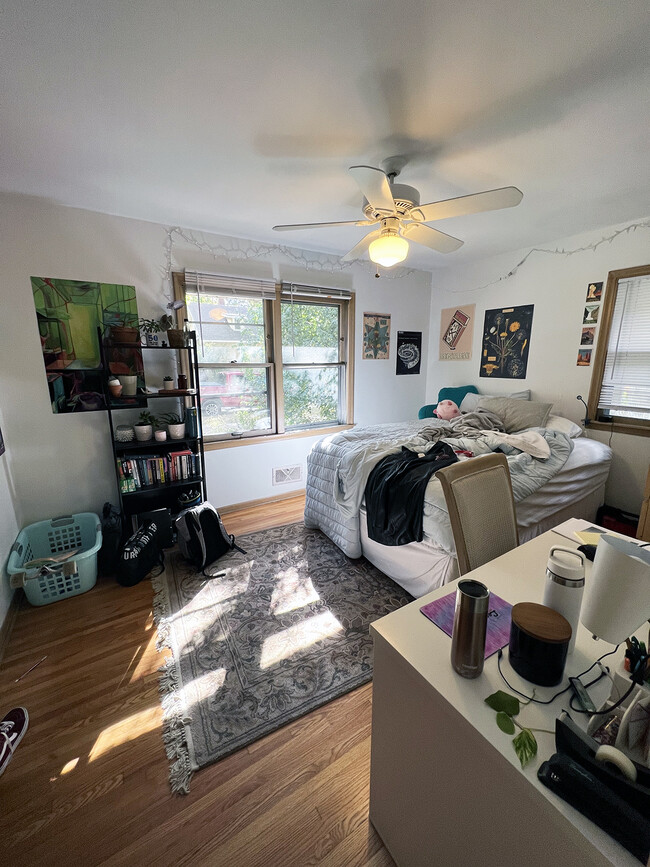 Main floor bedroom with ceiling fan. - 1911 Talmage Ave SE