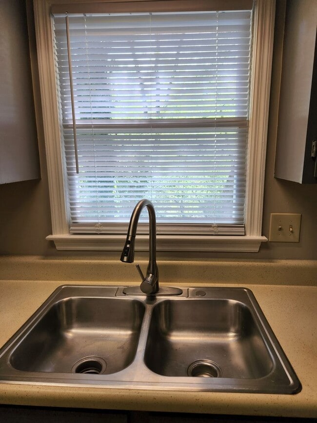 Building Photo - The Best of North Metro Living without the...