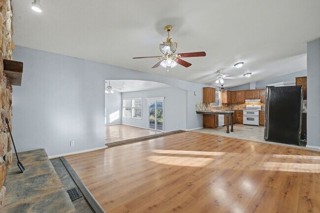 Building Photo - 3-Bed Home with Fireplace, Fenced Yard & Flexible Living Space