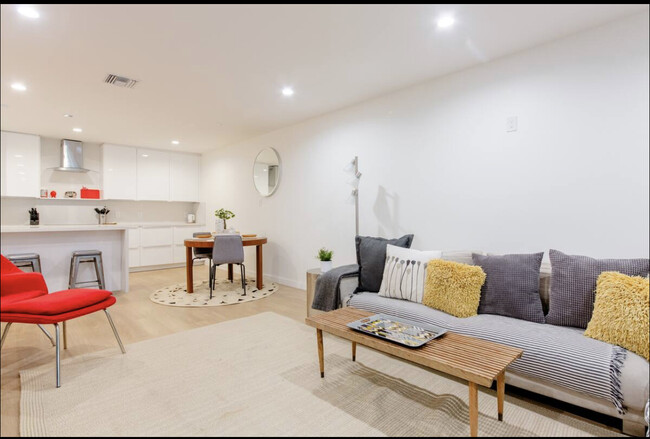 Living room facing kitchen - 8535 Knoll N W Dr